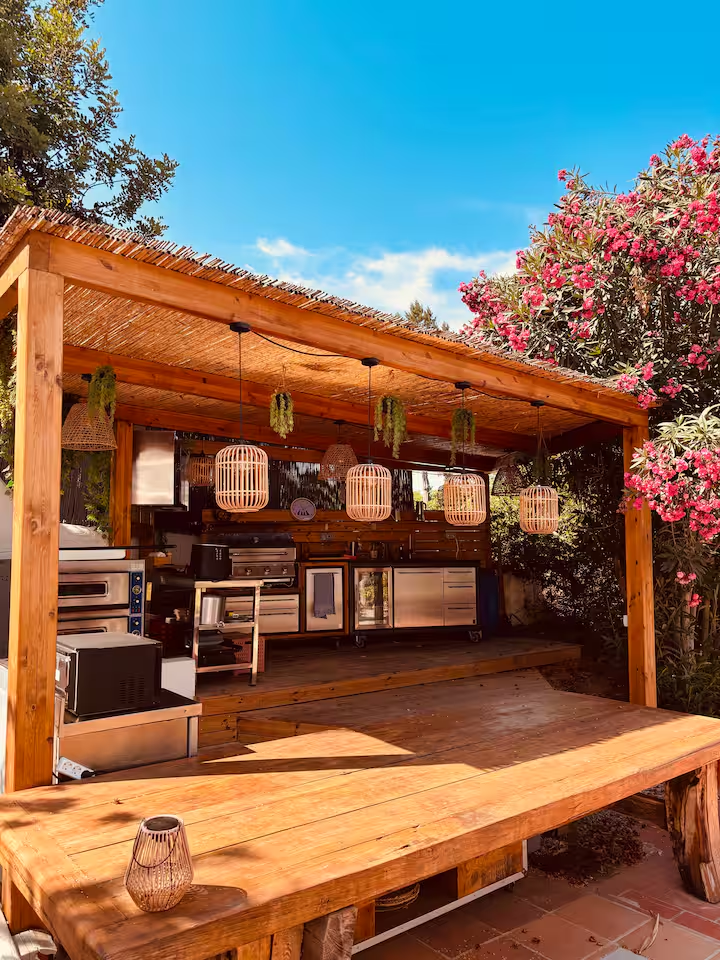 Outdoor kitchen under a bamboo pergola